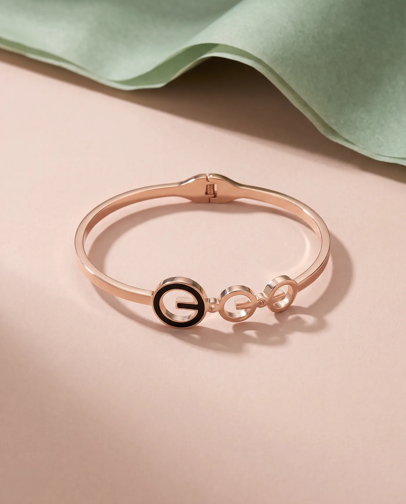 Orbit Bangle: Three linked rings, one in black