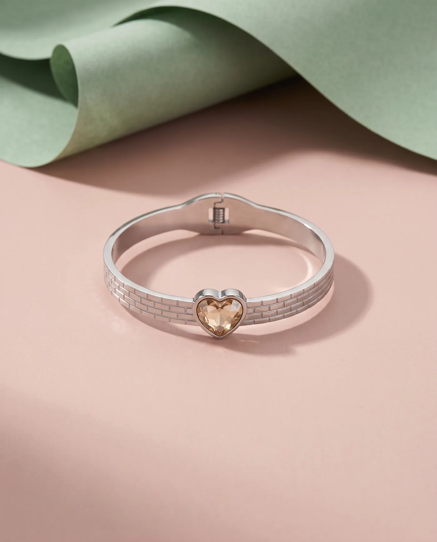 Champagne Heart Bangle: Faceted heart, brick-textured band